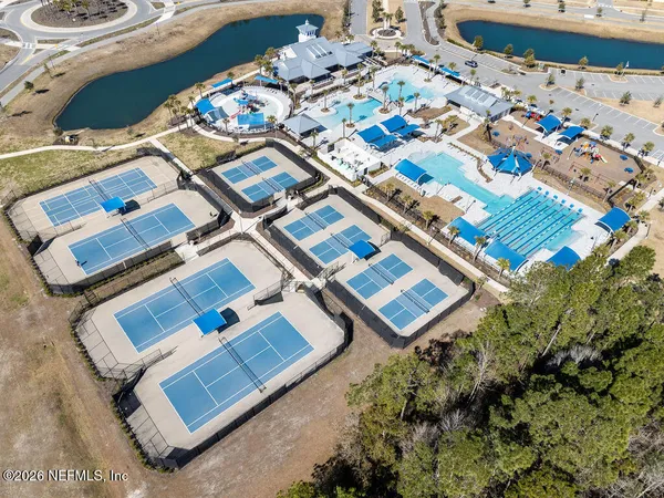 an aerial view of a balcony a rug and outdoor space