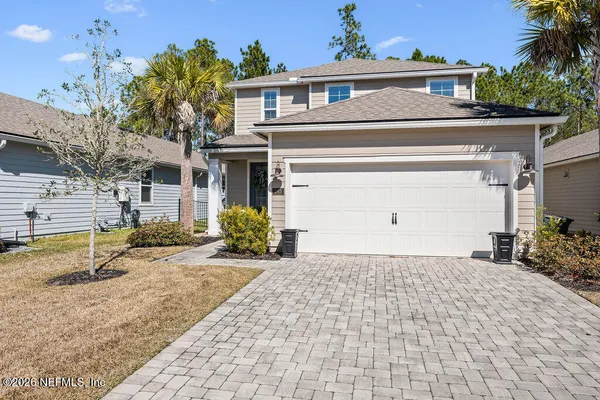 a view of a house with a sink and a yard