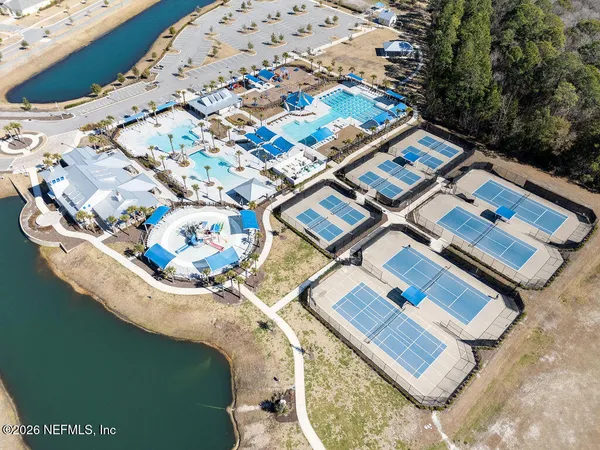 an aerial view of residential houses with outdoor space