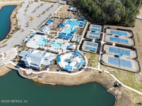 an aerial view of a houses with yard