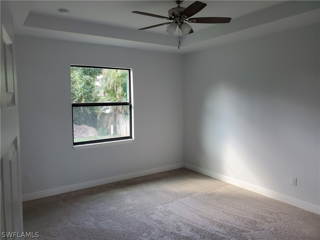 8072 Anhinga Road Fort Myers, FL 33967 - Photo 12 of 16 an empty room with a window