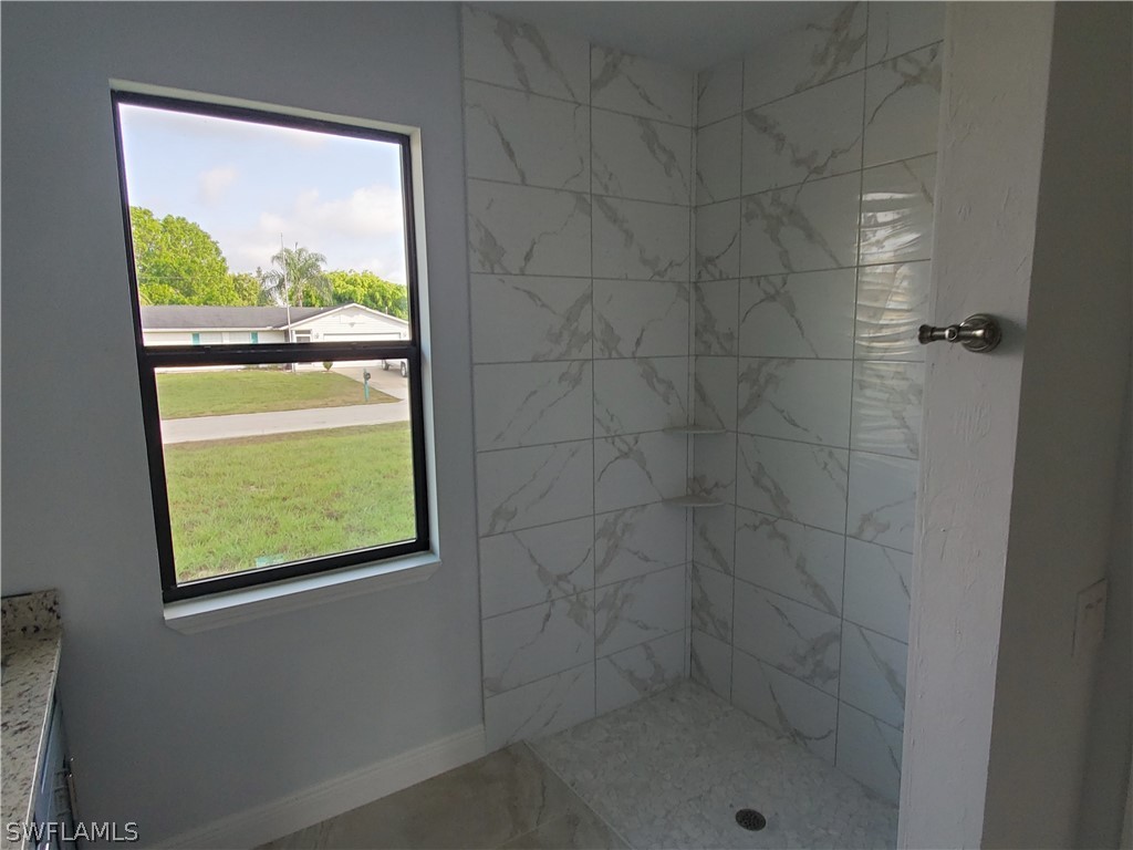 8072 Anhinga Road Fort Myers, FL 33967 - Photo 14 of 16 a bathroom with a window