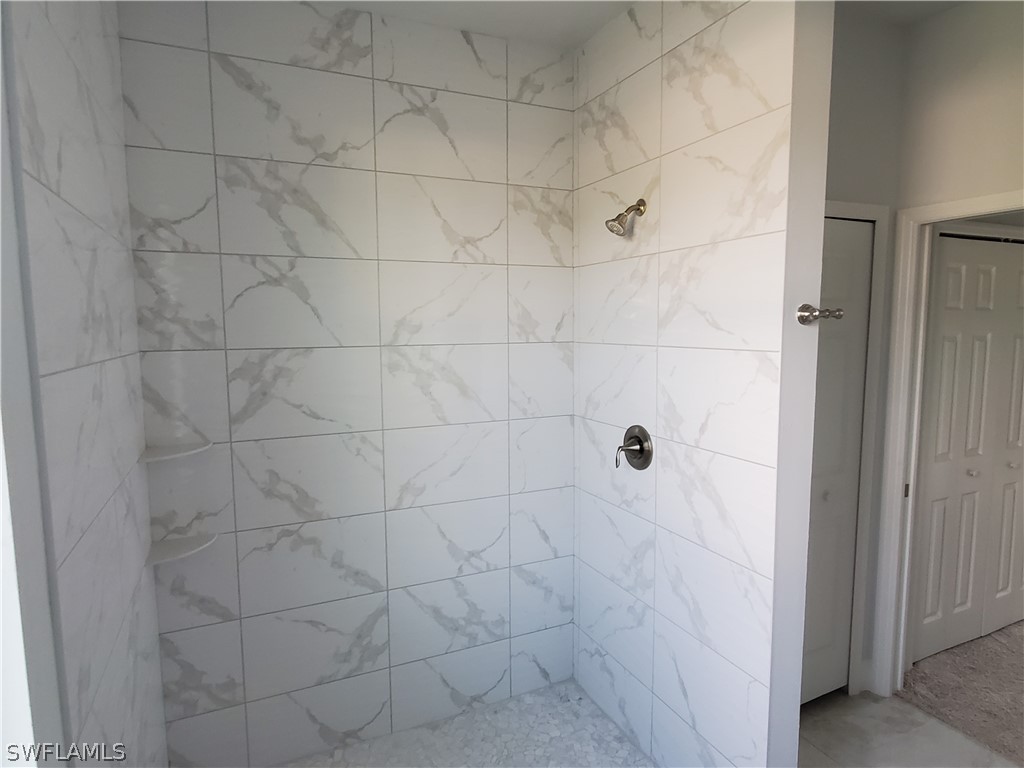8072 Anhinga Road Fort Myers, FL 33967 - Photo 15 of 16 a bathroom with a shower