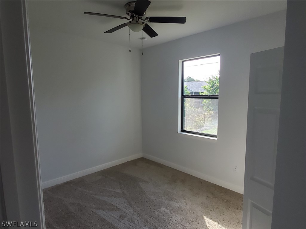 8072 Anhinga Road Fort Myers, FL 33967 - Photo 7 of 16 an empty room with a window