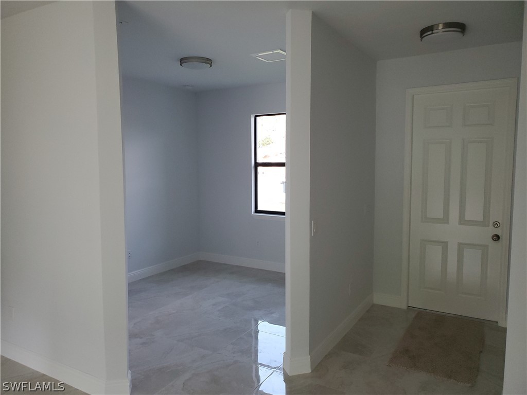 8072 Anhinga Road Fort Myers, FL 33967 - Photo 10 of 16 an empty room that has a window