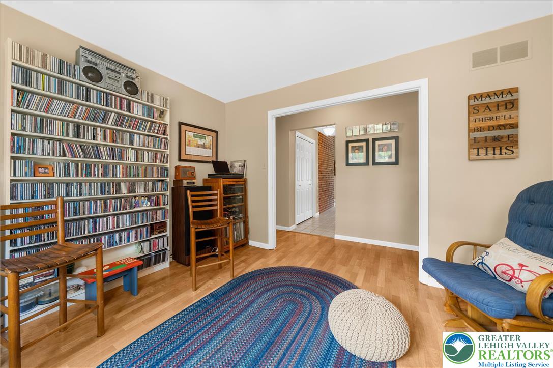 5616 Snowdrift Road Orefield, PA 18069 - Photo 12 of 36 Blonde hardwood flooring and light beige walls define a comfortable and inviting living area.