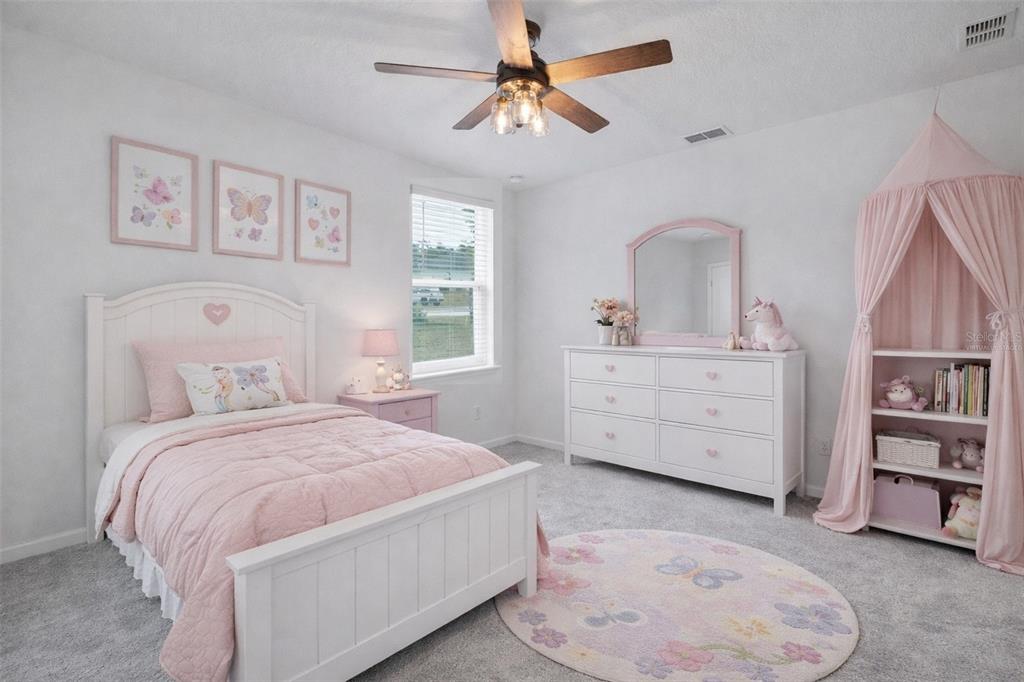 19426 Southwest 79th Street Dunnellon, FL 34432 - Photo 14 of 34 a bedroom with a bed dresser and a window