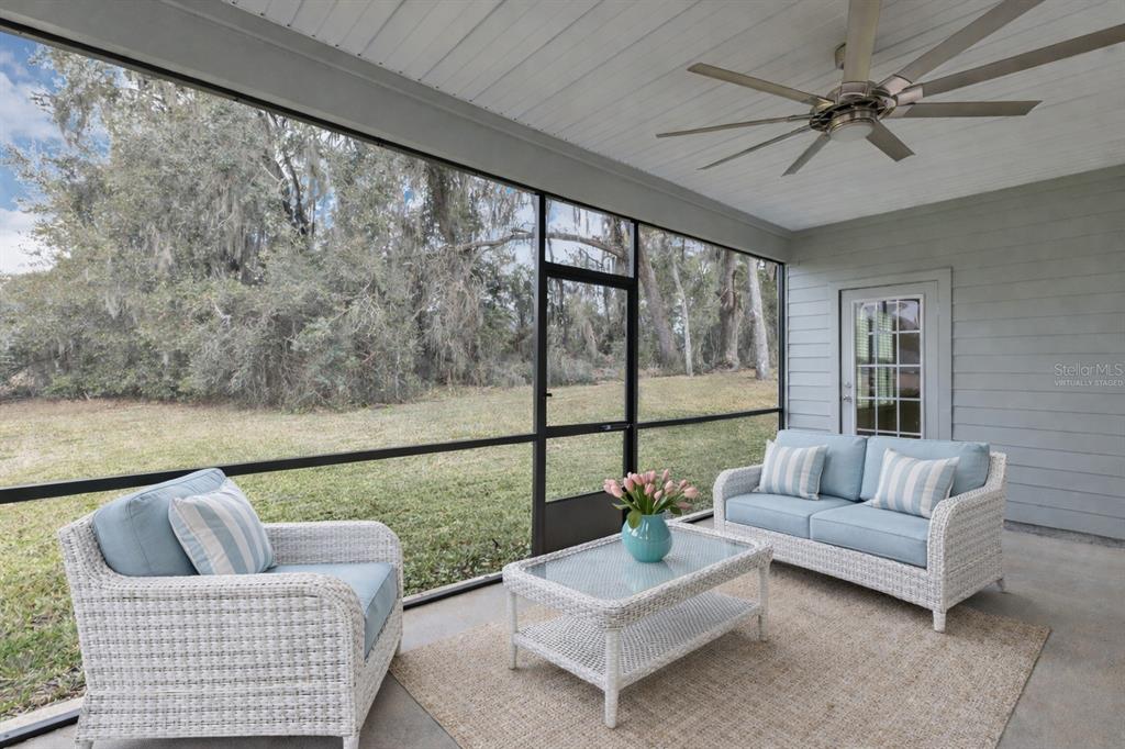 19426 Southwest 79th Street Dunnellon, FL 34432 - Photo 18 of 34 a living room with furniture and a large window