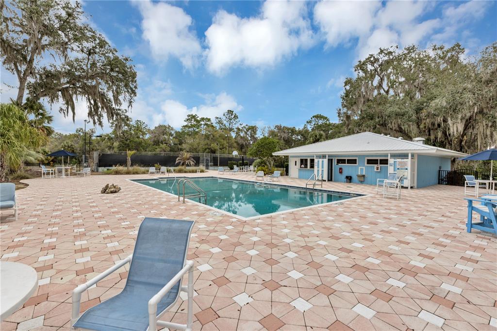 19426 Southwest 79th Street Dunnellon, FL 34432 - Photo 22 of 34 a view of house with swimming pool and sitting area