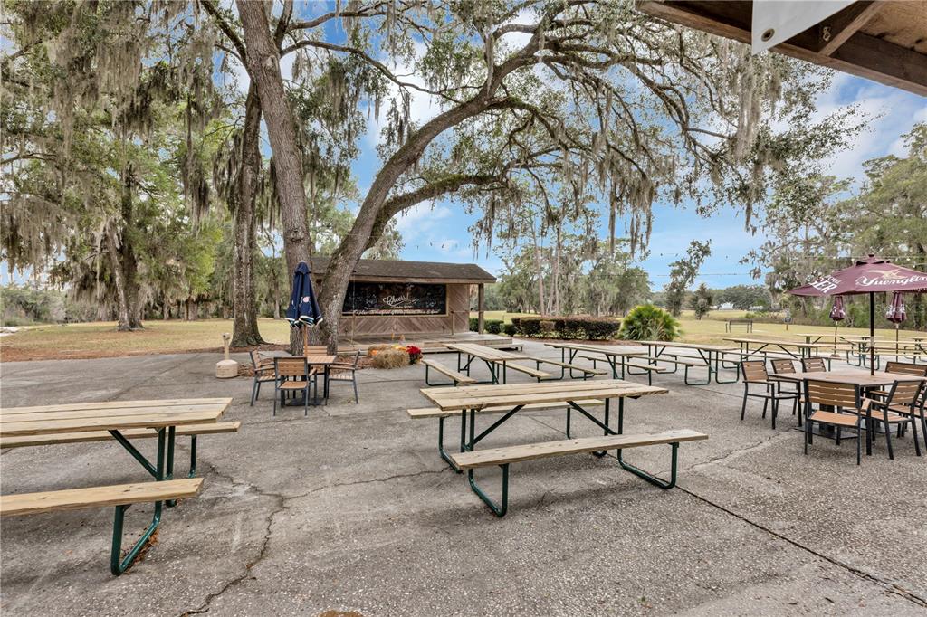 19426 Southwest 79th Street Dunnellon, FL 34432 - Photo 27 of 34 a view of a tables and chairs in a patio