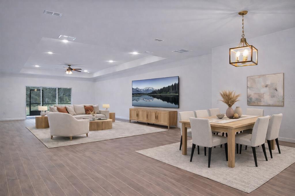 19426 Southwest 79th Street Dunnellon, FL 34432 - Photo 5 of 34 a view of a dining room with furniture wooden floor and chandelier