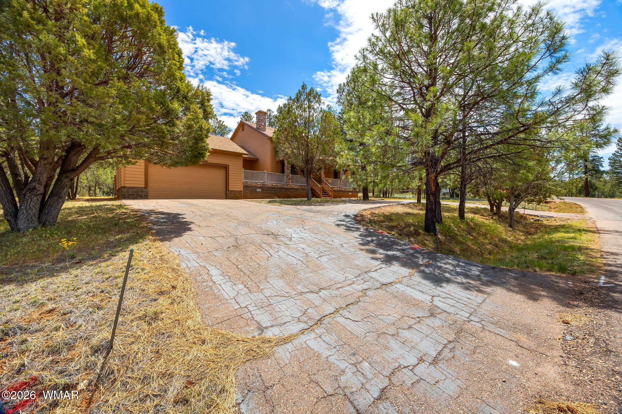 2937 Ransack Road Overgaard, AZ 85933 - Photo 26 of 34 a front view of a house with a yard