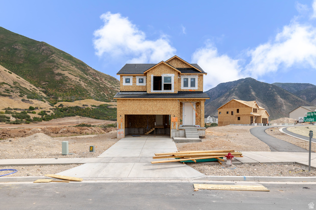 52 Linden Lane, Unit 1018 Mapleton, UT 84664 - Photo 1 of 5 Two-story residential structure with a shingled roof, attached garage, and a concrete driveway