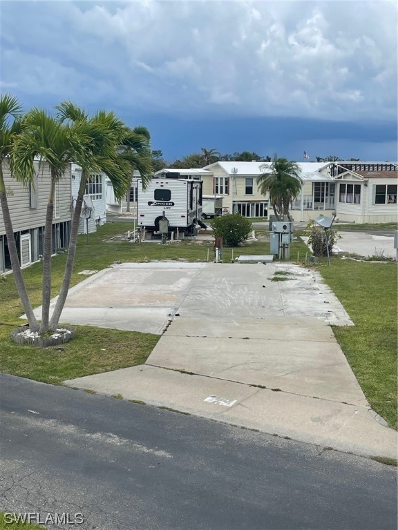 19681 Summerlin Road, Unit 324 Fort Myers, FL 33908 - Photo 2 of 10 a front view of building with yard