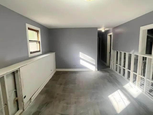 a view of entryway and hall with a window