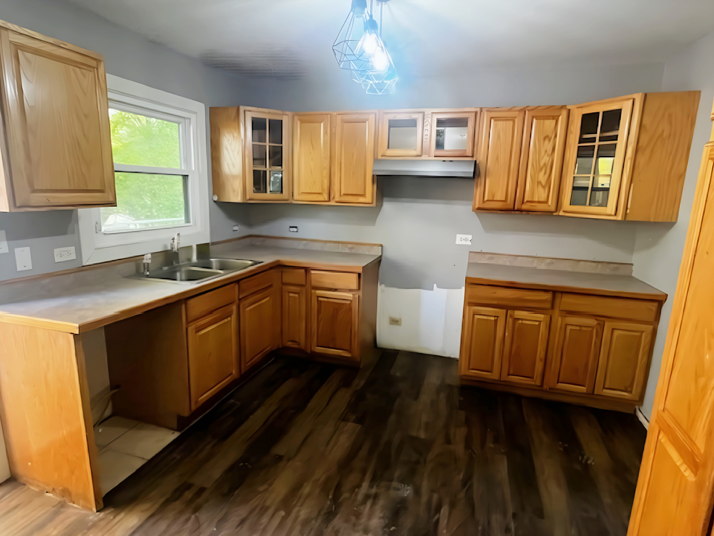 35531 Sunnyside Avenue Ingleside, IL 60041 - Photo 6 of 17 a kitchen with wooden cabinets and sink