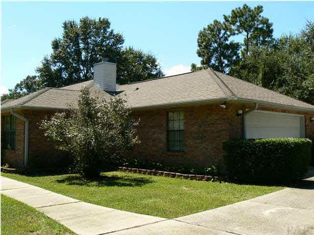 6545 Martin Road Milton, FL 32570 - Photo 13 of 18 Partial view of front of home showing side entry garage and front lawn area ready to add your favorite plants.