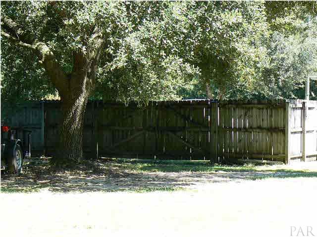 6545 Martin Road Milton, FL 32570 - Photo 15 of 18 Double gate, backyard is completely enclosed by privacy fence.
