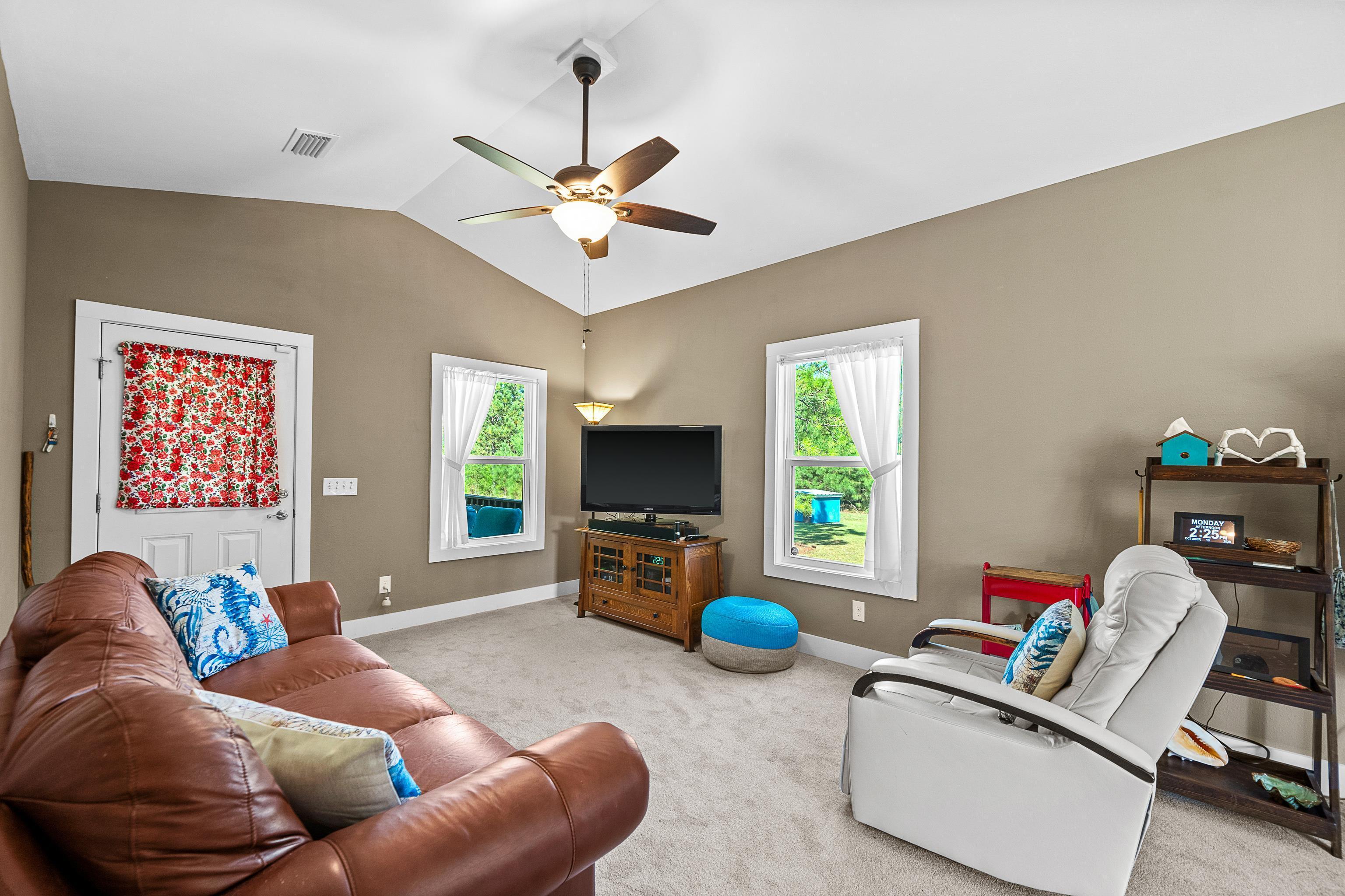 24616 Bretz Lane Elberta, AL 36530 - Photo 16 of 42 Living room with vaulted ceiling and abundant natural light.
