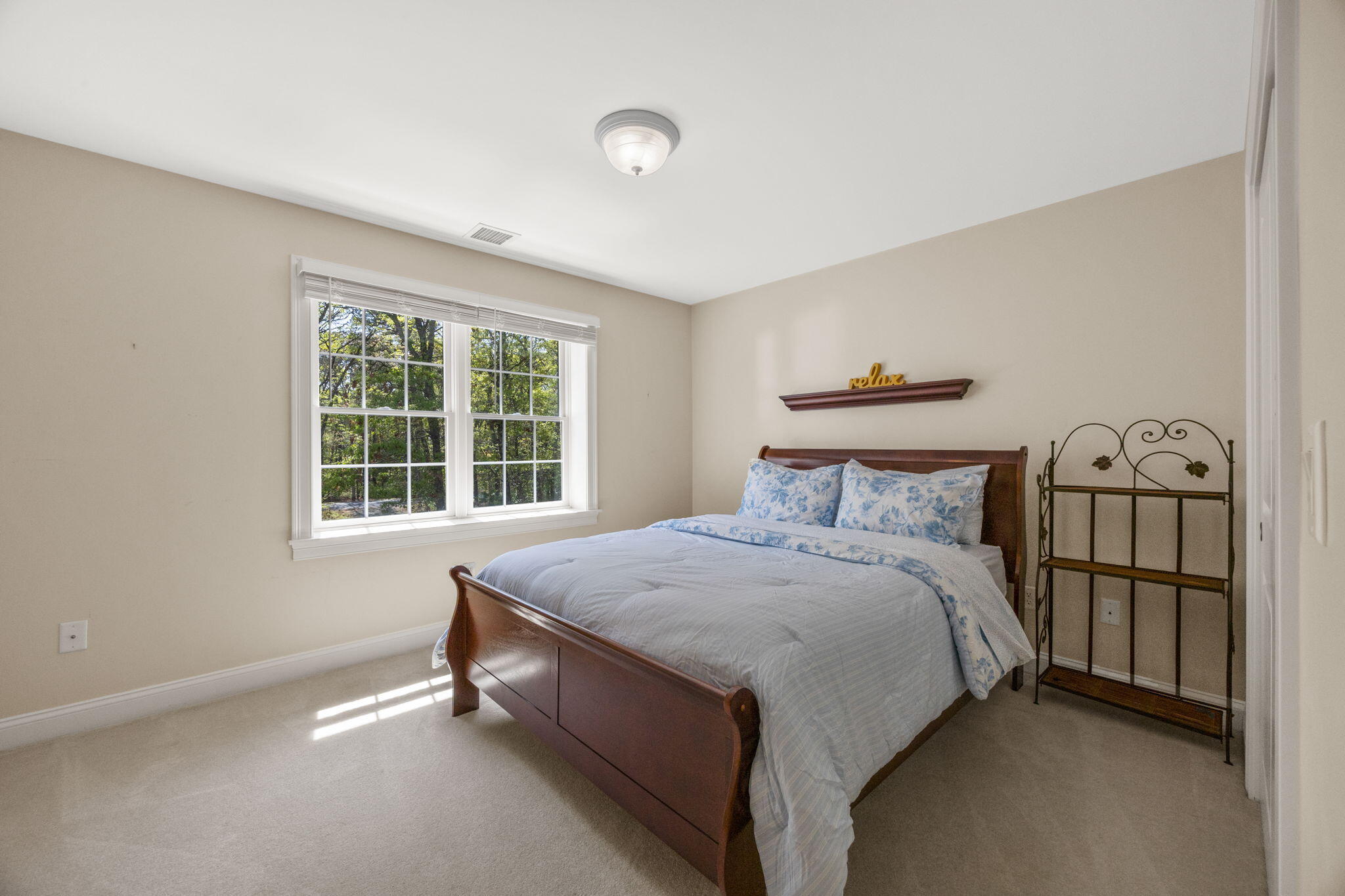 17 Payamps Road Mashpee, MA 02649 - Photo 46 of 72 a bed sitting in a room next to a window