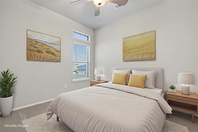 a bedroom with bed and window