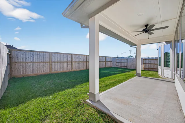 a view of a backyard with wooden floor and a garden