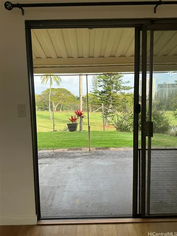 a view of a porch with a big yard