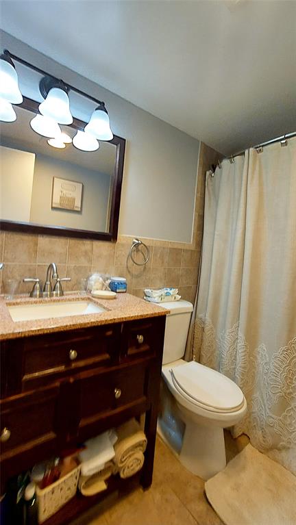 367 South Federal Highway, Unit C225 Deerfield Beach, FL 33441 - Photo 14 of 36 a bathroom with a sink vanity mirror and toilet