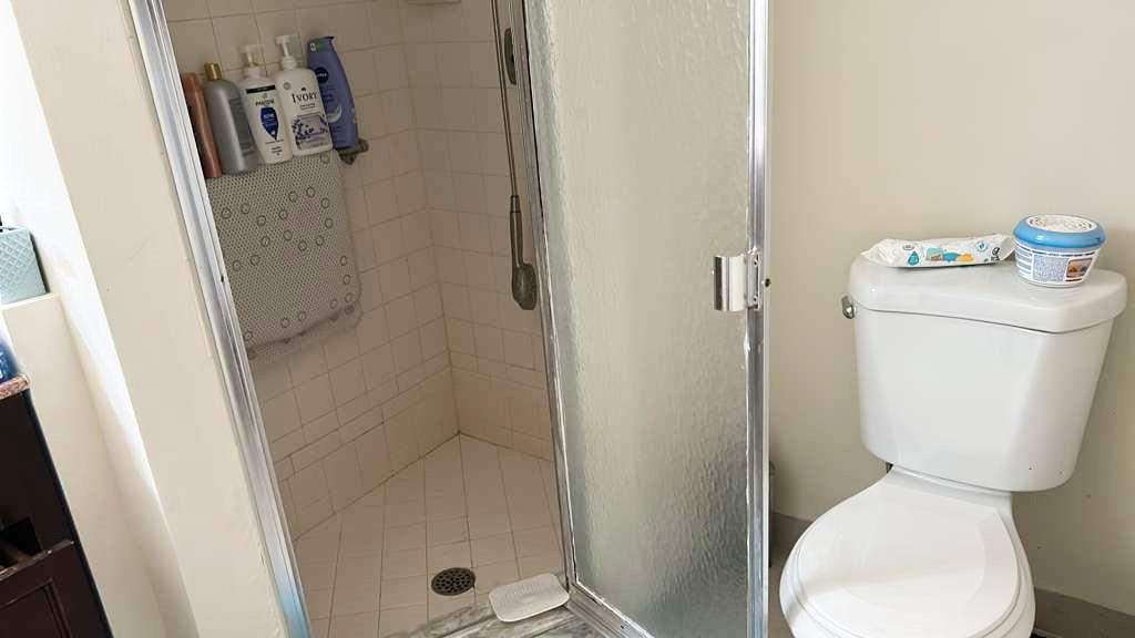 367 South Federal Highway, Unit C225 Deerfield Beach, FL 33441 - Photo 19 of 36 a bathroom with a toilet and shower