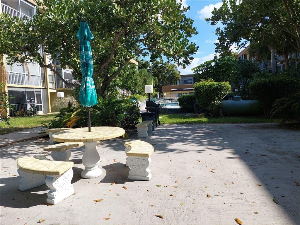 367 South Federal Highway, Unit C225 Deerfield Beach, FL 33441 - Photo 25 of 36 a view of a house with backyard and sitting area