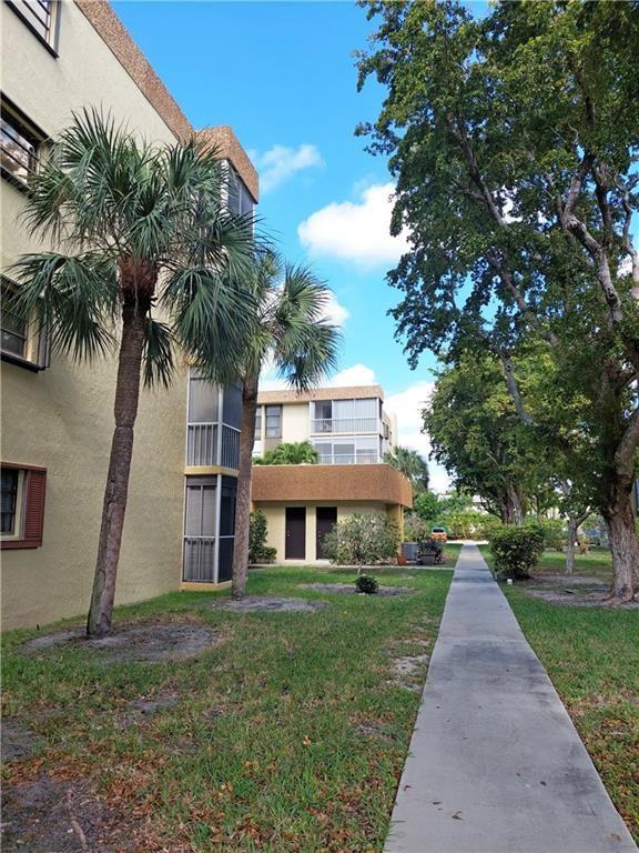 367 South Federal Highway, Unit C225 Deerfield Beach, FL 33441 - Photo 30 of 36 a front view of house with yard and green space