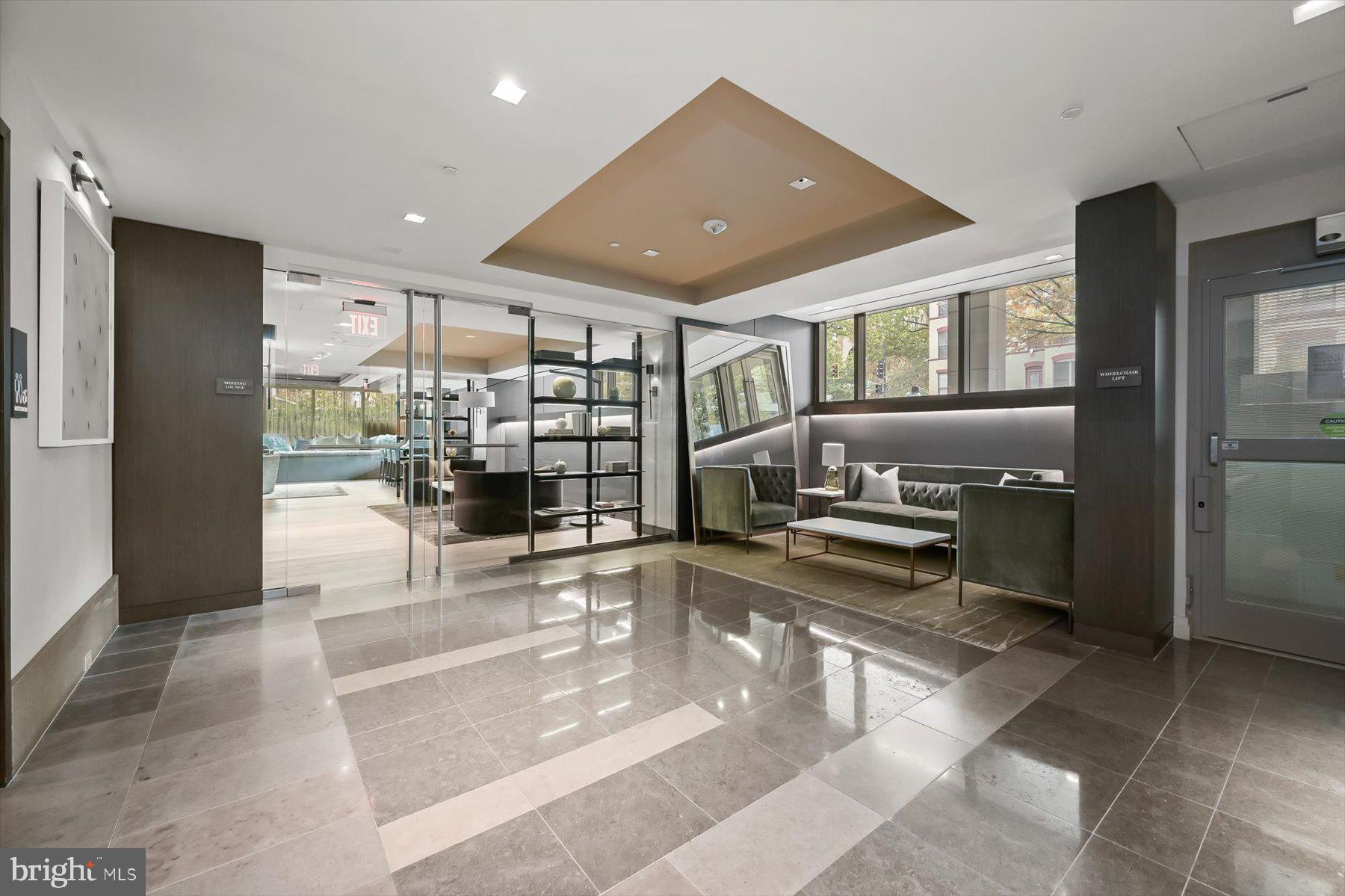 2501 M Street Northwest, Unit 612 Washington, DC 20037 - Photo 34 of 44 a open kitchen with stainless steel appliances kitchen island granite countertop a refrigerator and a sink