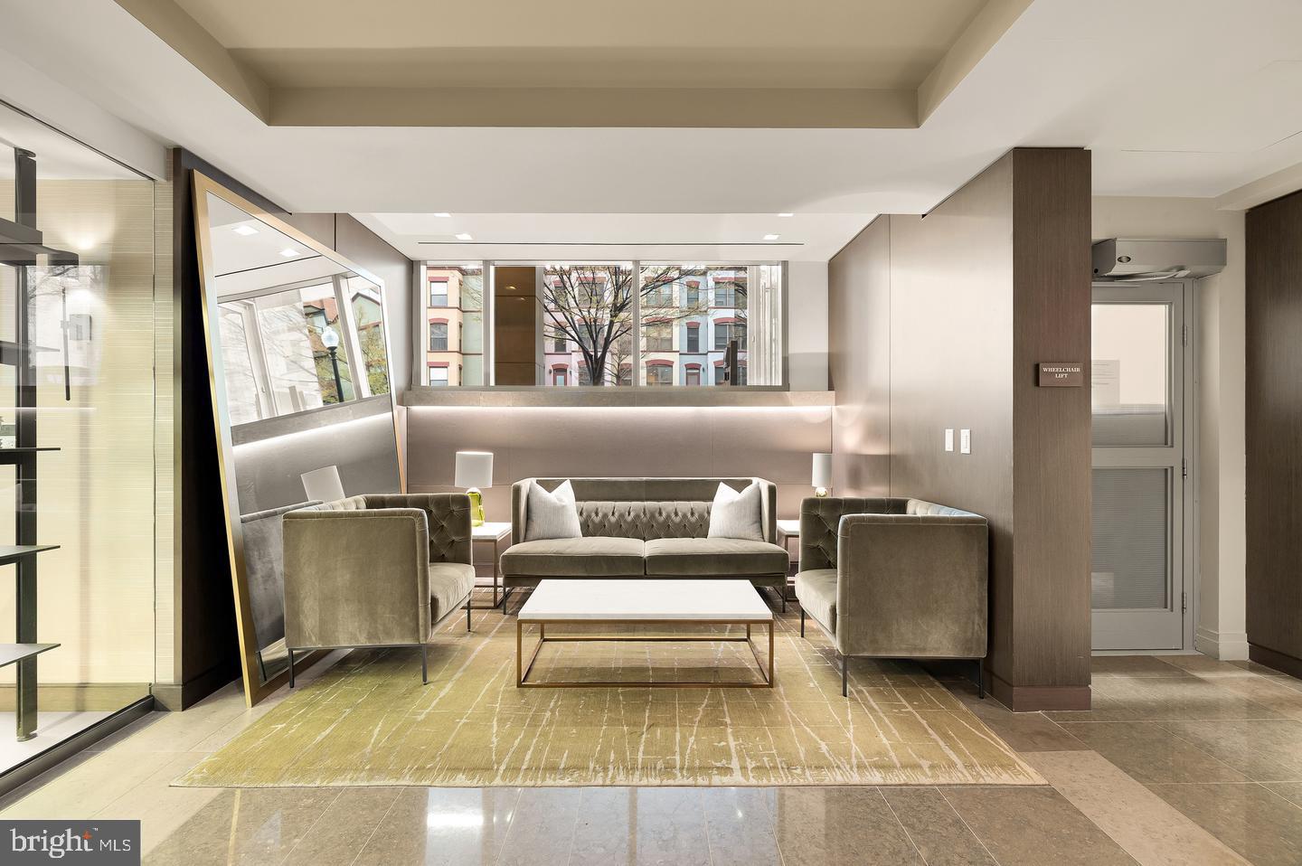 2501 M Street Northwest, Unit 612 Washington, DC 20037 - Photo 35 of 44 a living room with furniture and a large window