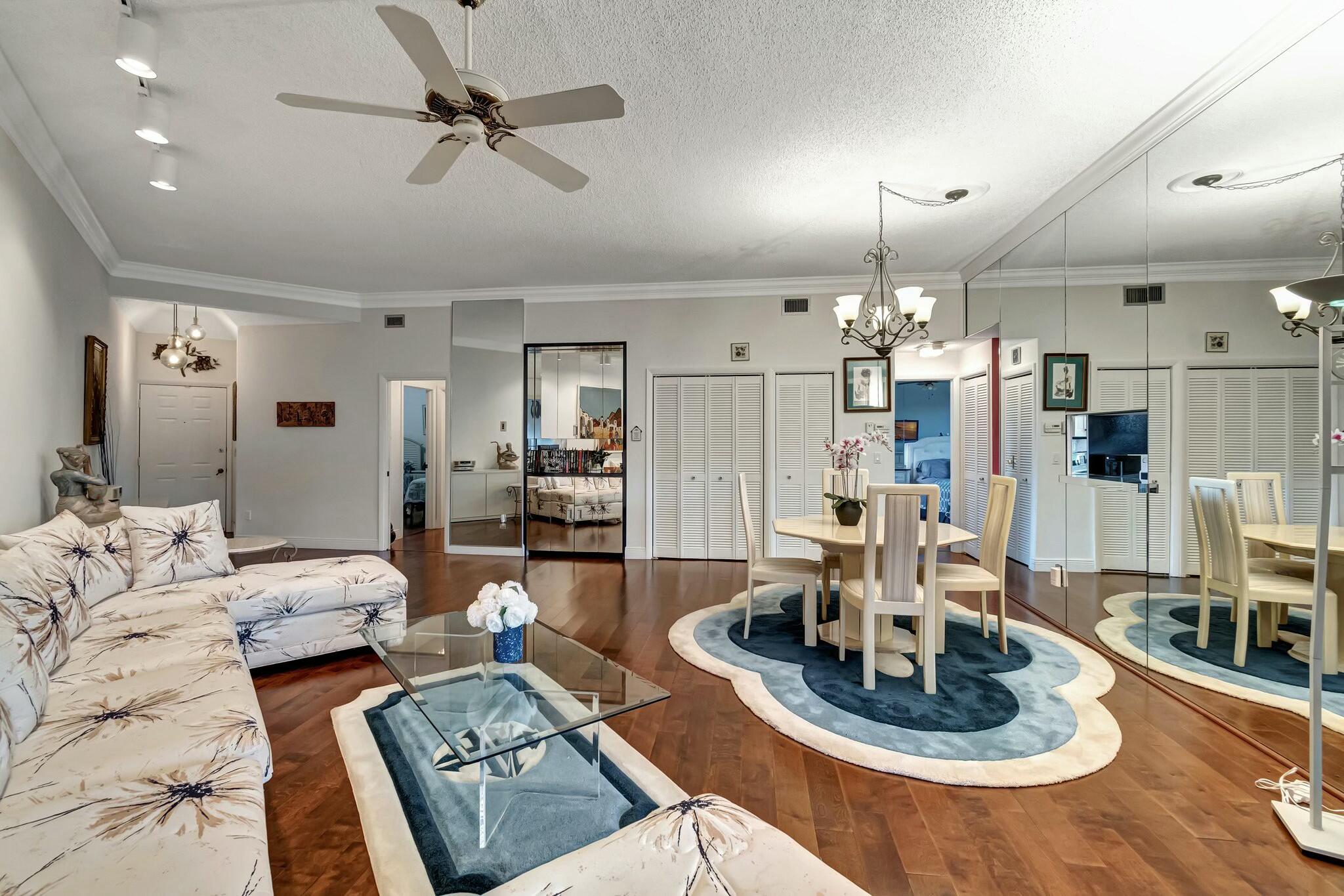 7448 La Paz Boulevard, Unit 102 Boca Raton, FL 33433 - Photo 2 of 23 LIVING ROOM DINING AREA