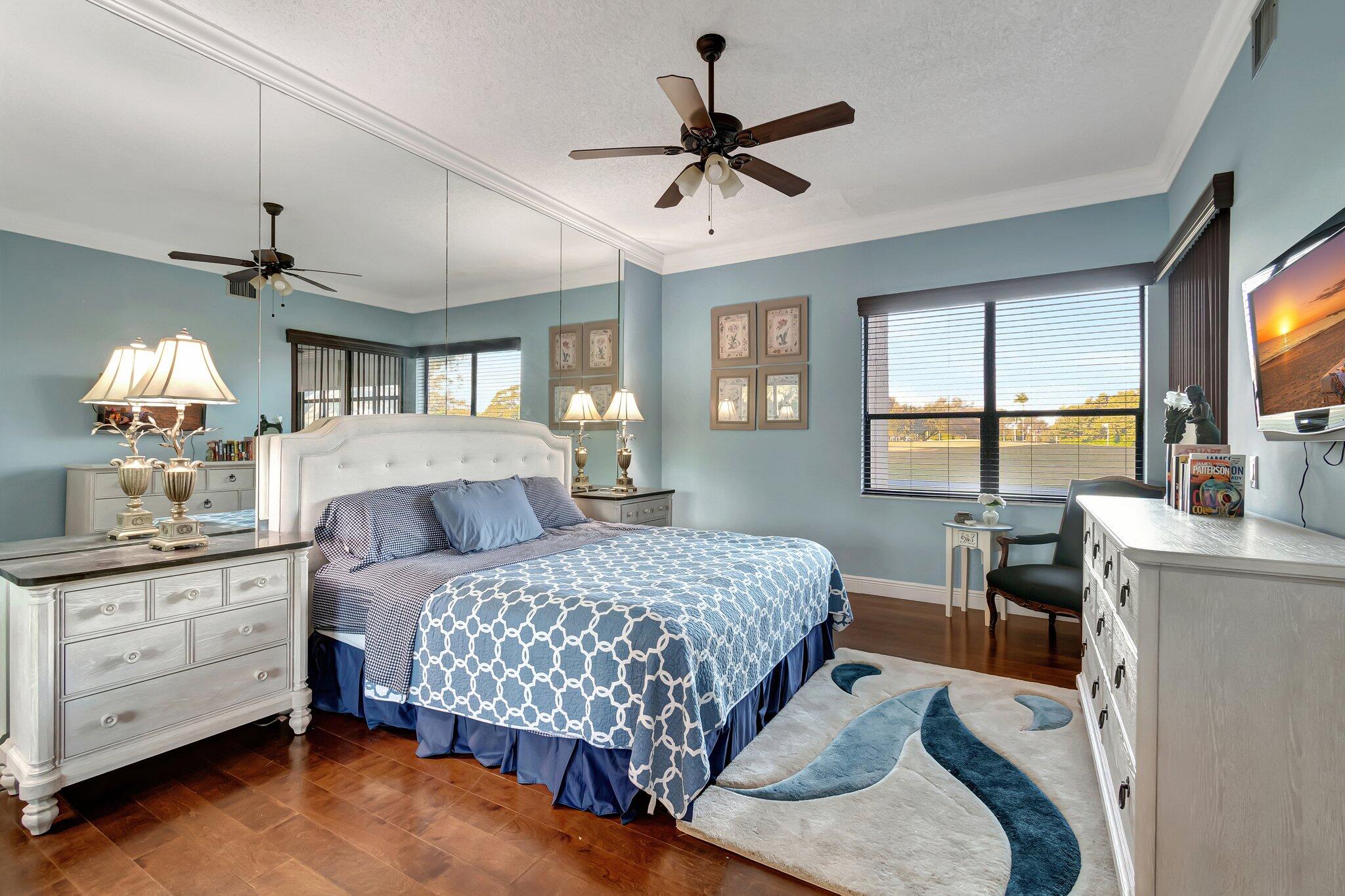 7448 La Paz Boulevard, Unit 102 Boca Raton, FL 33433 - Photo 7 of 23 PRIMARY SUITE OVERLOOKING GOLF COURSE
