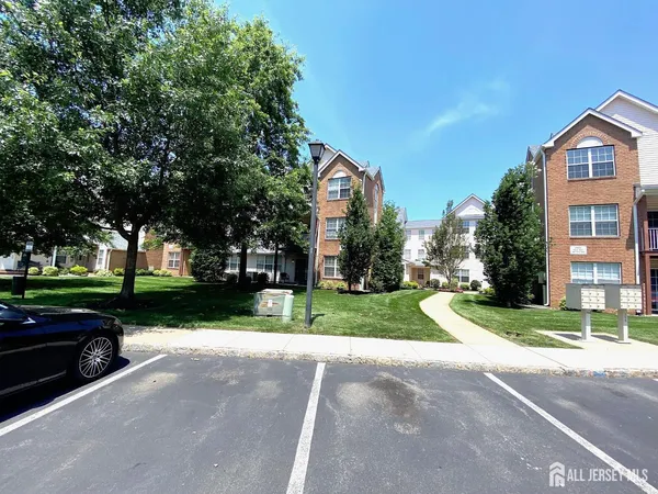 a view of a street with houses on both side
