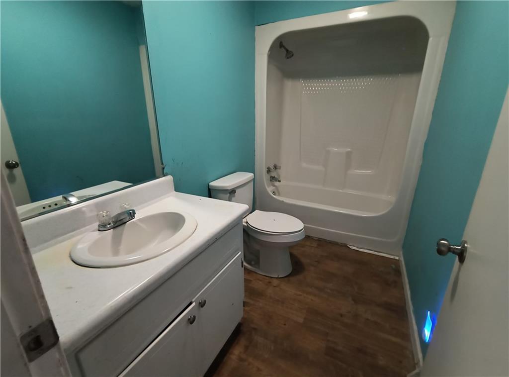 89 Murray Springs Road Chatsworth, GA 30705 - Photo 13 of 14 a bathroom with a sink toilet and a bathtub
