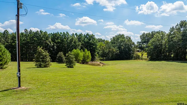 a kitchen with stainless steel appliances granite countertop a refrigerator and a stove