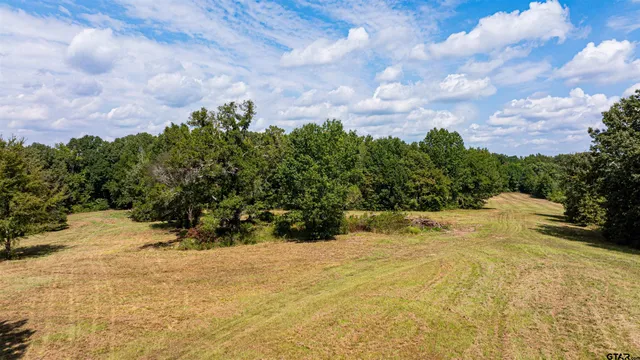 a kitchen with stainless steel appliances granite countertop a stove and a refrigerator