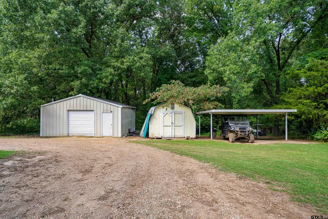 a view of a swimming pool with an outdoor space and seating area