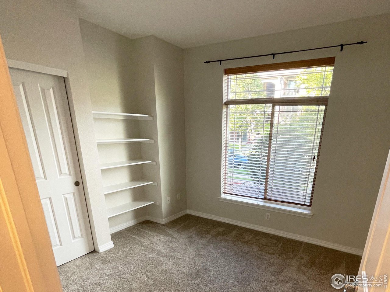 2133 Krisron Road, Unit 103 Fort Collins, CO 80525 - Photo 11 of 26 2nd Bedroom with built-in shelves