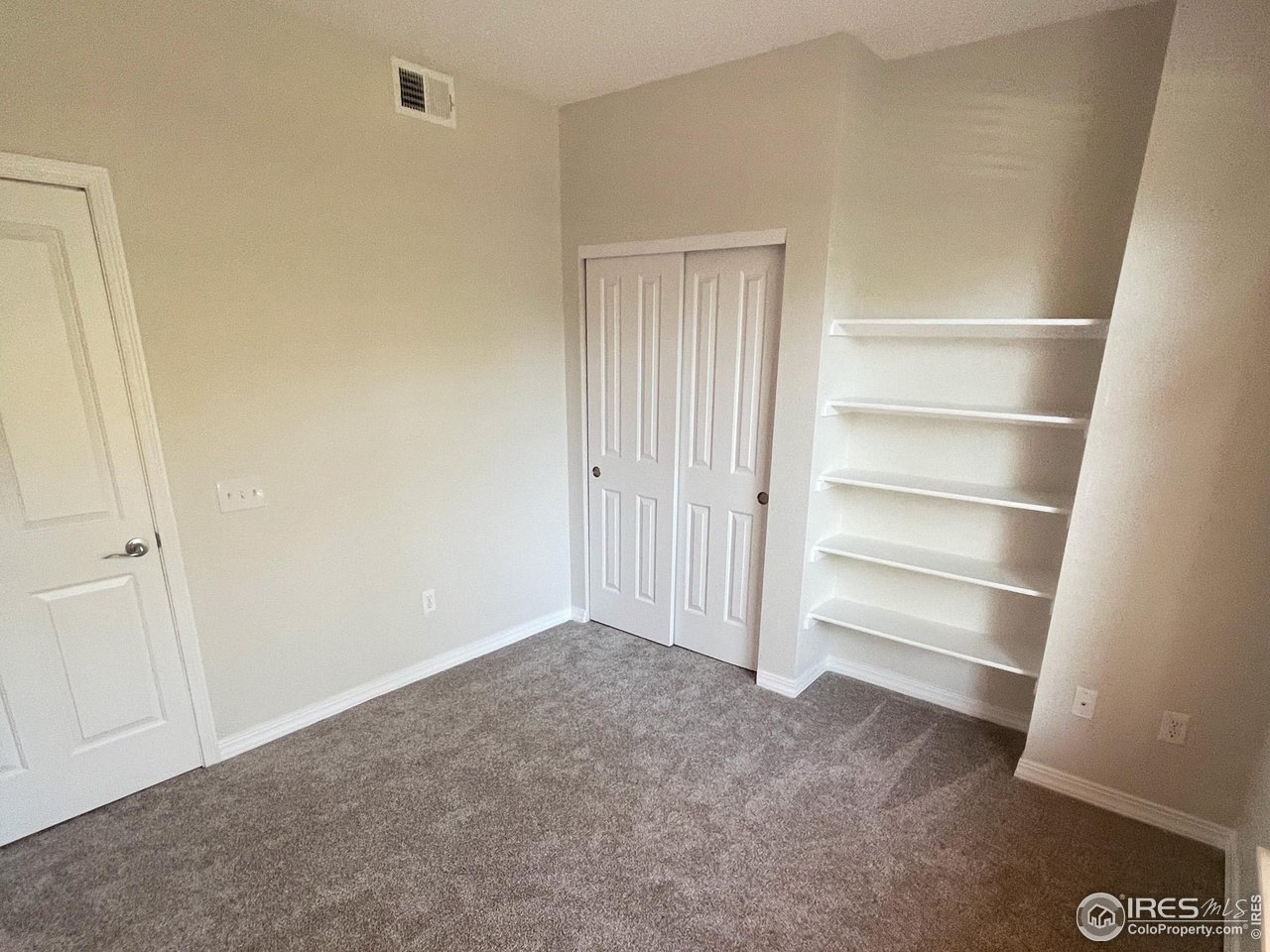 2133 Krisron Road, Unit 103 Fort Collins, CO 80525 - Photo 12 of 26 2nd Bedroom with built-in shelves