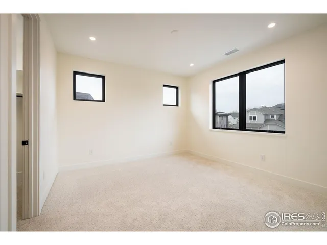 a bathroom with a double vanity sink mirror and bathtub