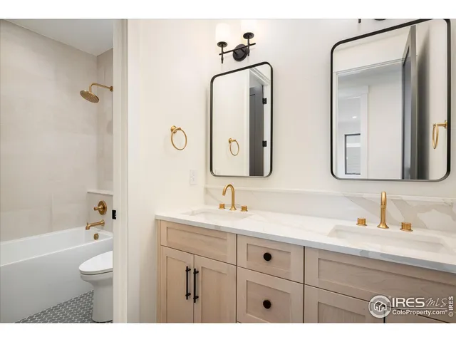 a kitchen with white cabinets and a sink