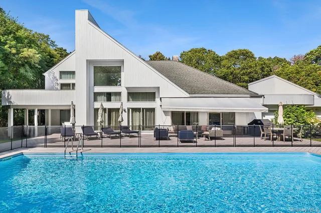 a front view of a house with garden and porch