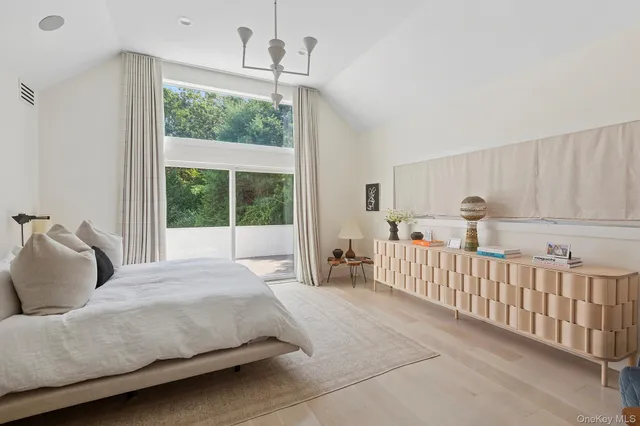 a bedroom with bed and window