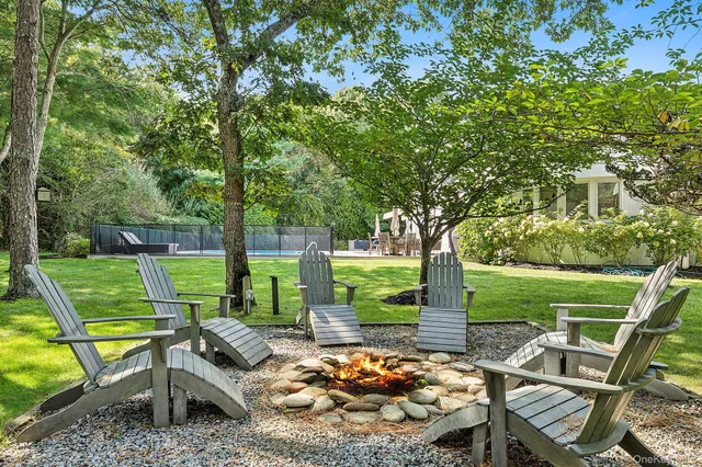 a view of a patio with chairs and a table