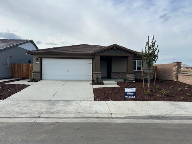 213 Moss Rnch Way Patterson, CA 95363 - Photo 1 of 1 a front view of a house with a garage