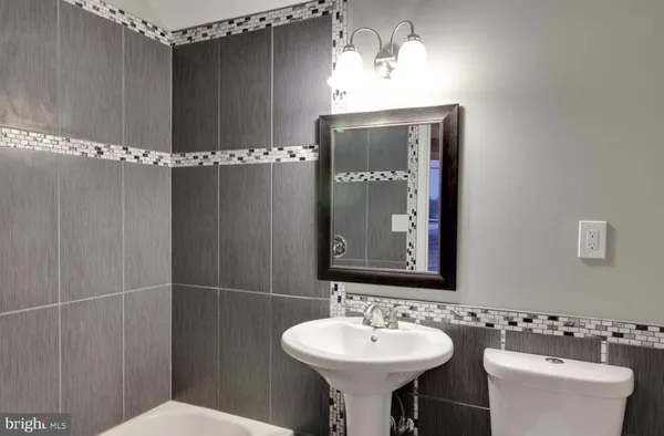 a bathroom with a shower and a toilet