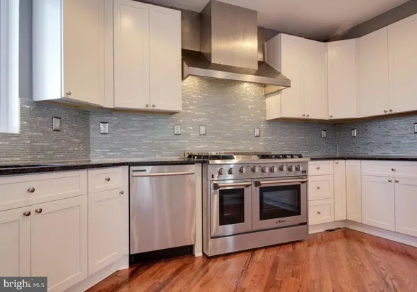 a view of a dining room with furniture and window